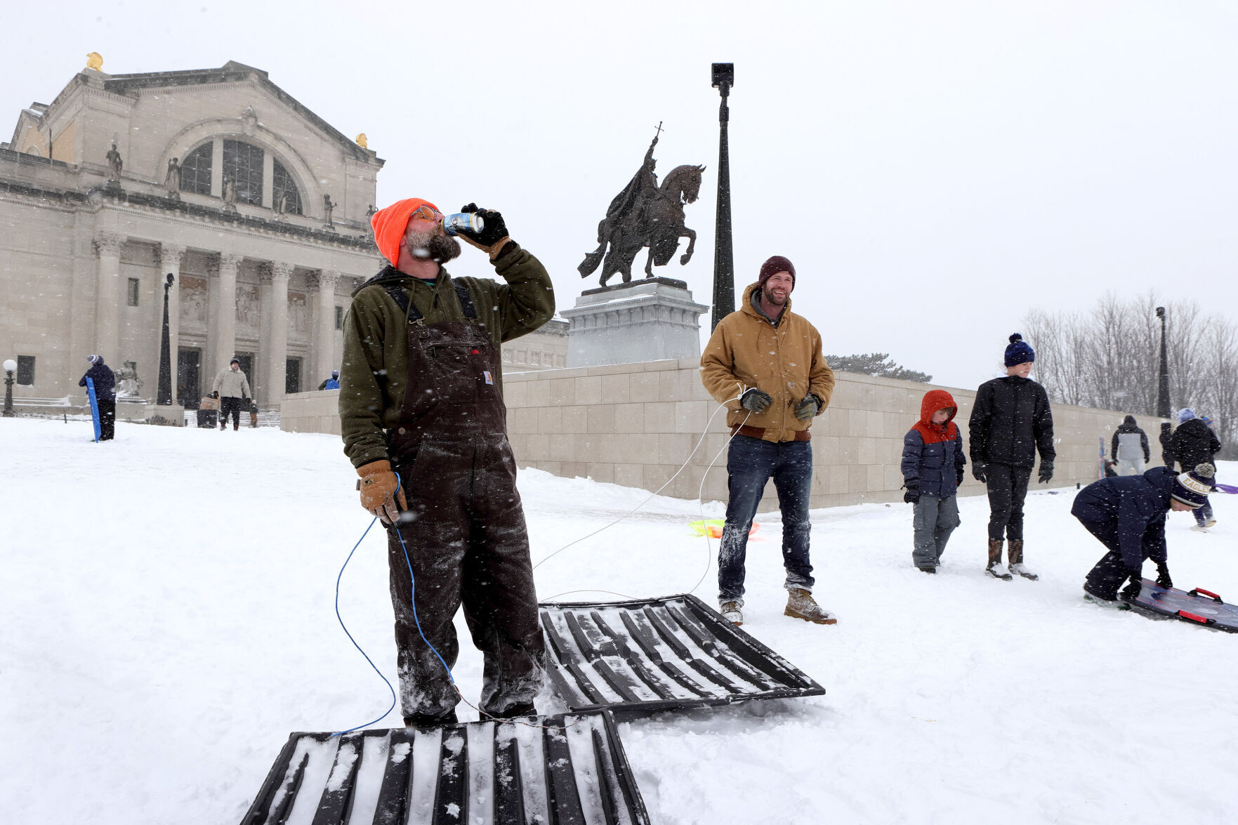 Dumpster lid sledding at Art Hill